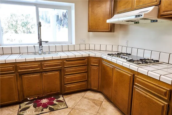 a view of a kitchen with furniture and a fireplace