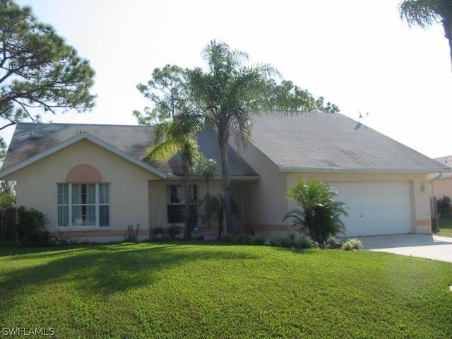 17433 Braddock Road Fort Myers, FL 33967 - Photo 1 of 1 a front view of house with a garden