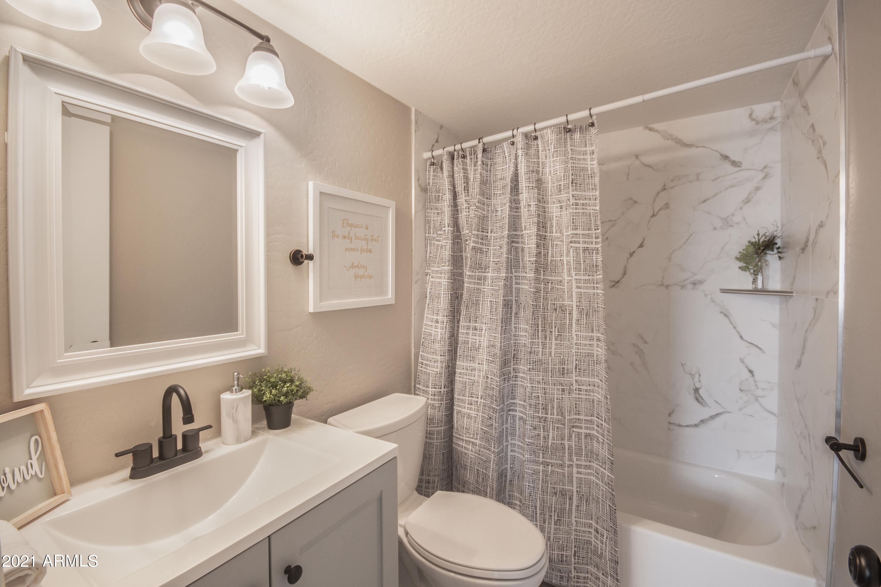 4923 West Granada Road Phoenix, AZ 85035 - Photo 16 of 27 a bathroom with a sink toilet and shower