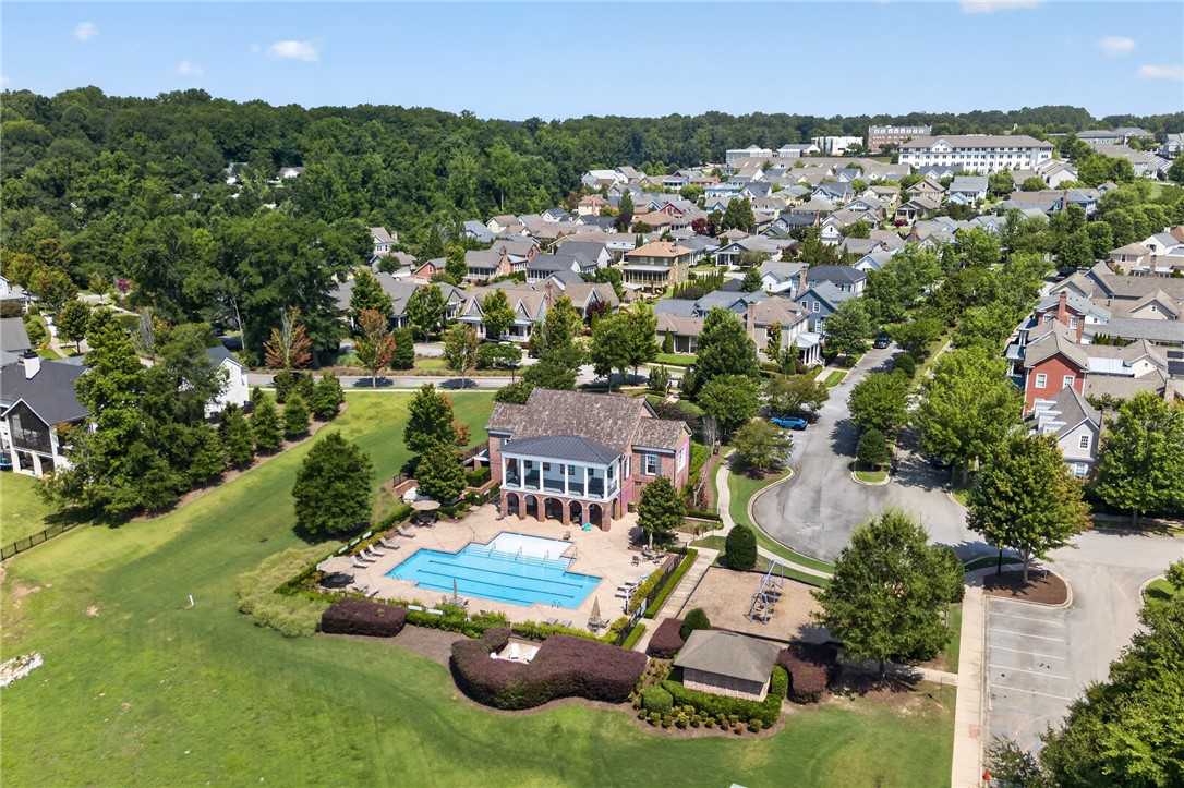 112 Tuttle Street Clemson, SC 29631 - Photo 45 of 46 An aerial perspective reveals a vibrant community with a grand club house and inviting pool.