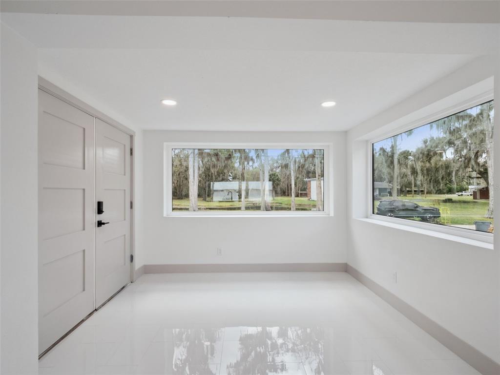28055 Leuty Road Yalaha, FL 34797 - Photo 12 of 39 a view of an empty room with a window