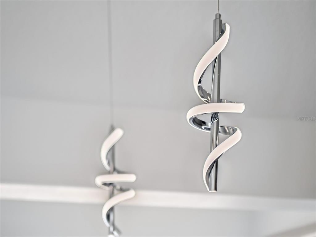 28055 Leuty Road Yalaha, FL 34797 - Photo 17 of 39 a bathroom with a light fixture and a window