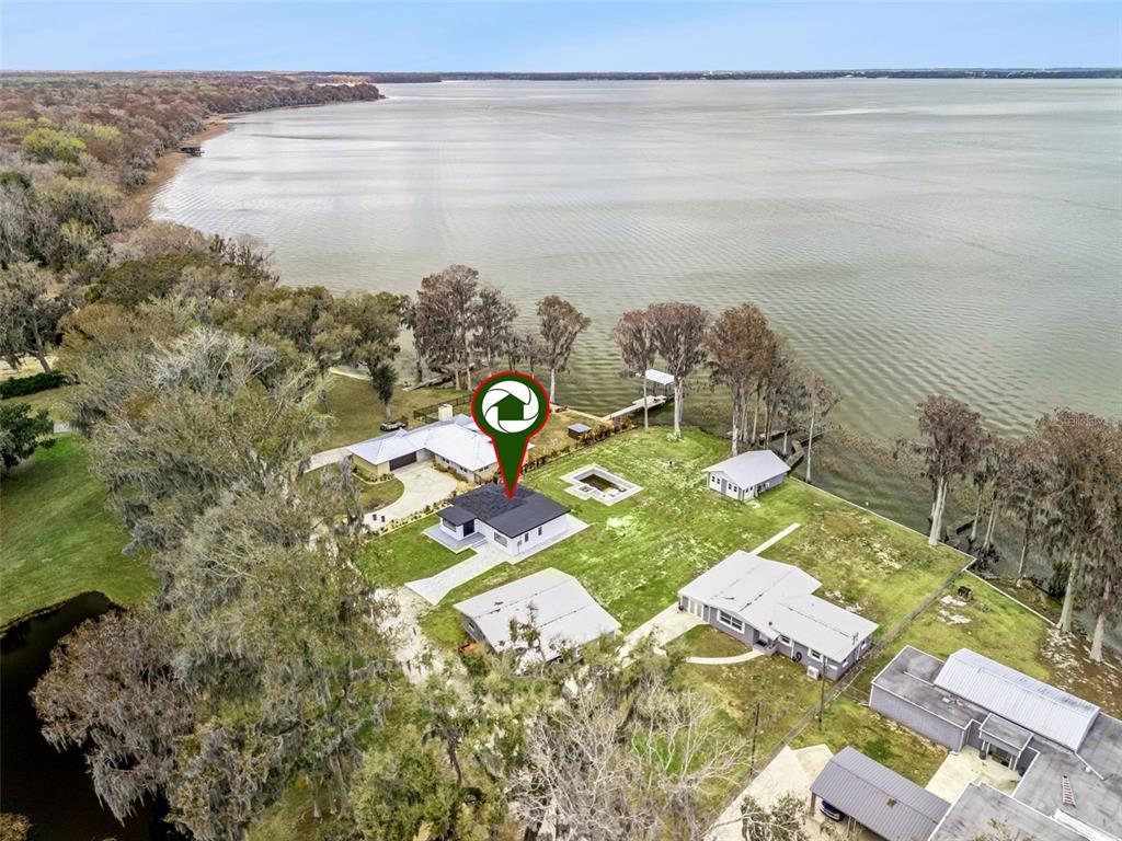28055 Leuty Road Yalaha, FL 34797 - Photo 2 of 39 a view of a lake with a mountain