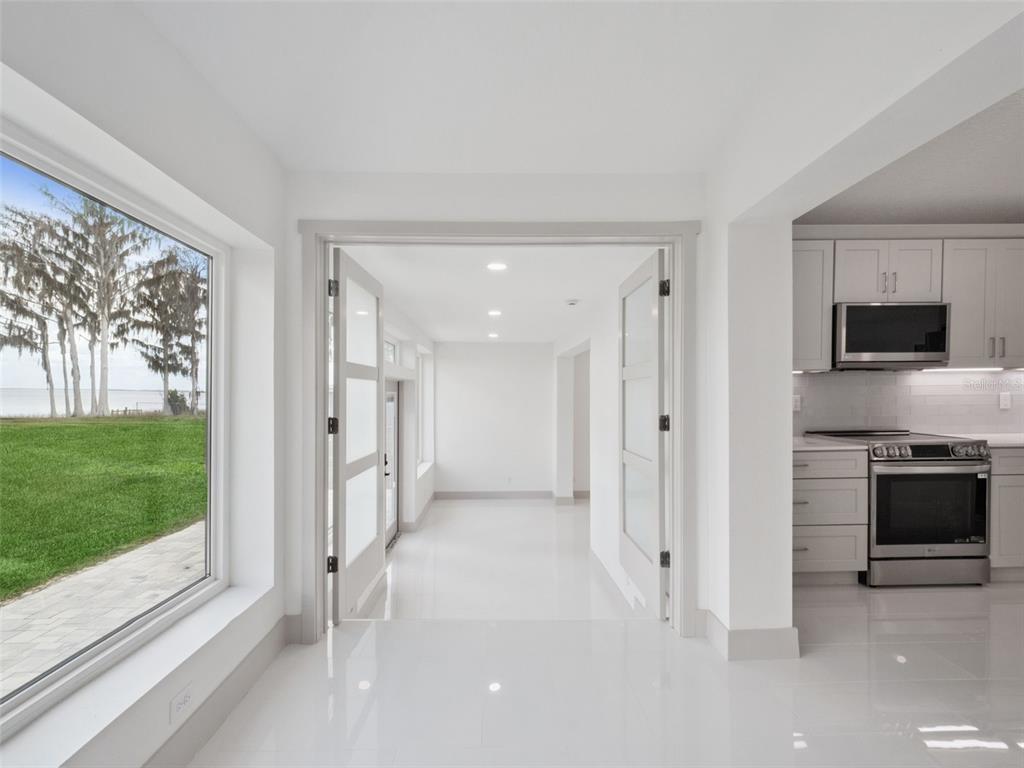 28055 Leuty Road Yalaha, FL 34797 - Photo 21 of 39 a view of a kitchen with a sink and a fireplace