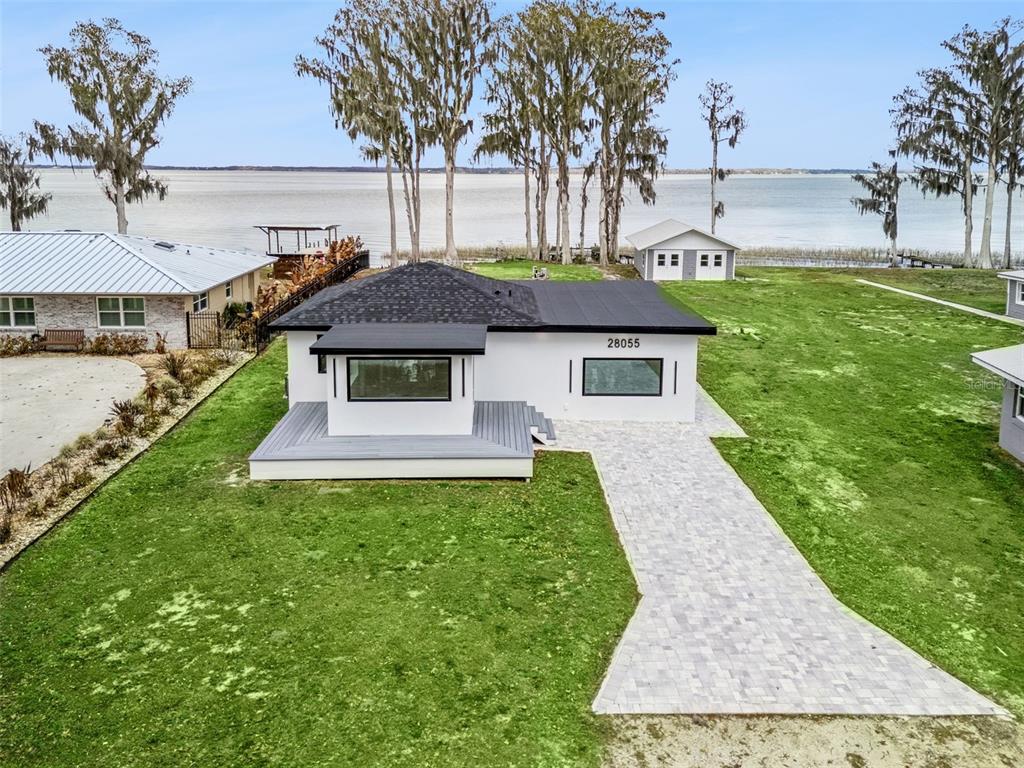 28055 Leuty Road Yalaha, FL 34797 - Photo 28 of 39 a front view of a house with garden