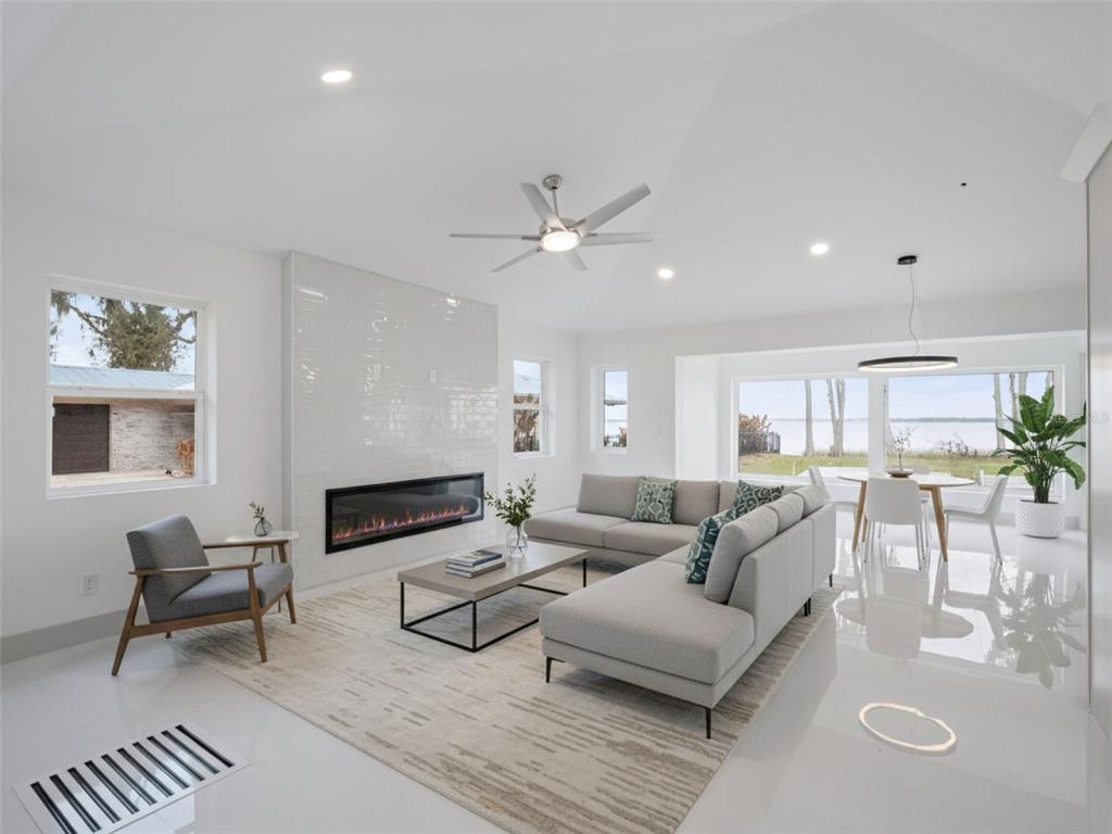 28055 Leuty Road Yalaha, FL 34797 - Photo 5 of 39 a living room with furniture and a fireplace