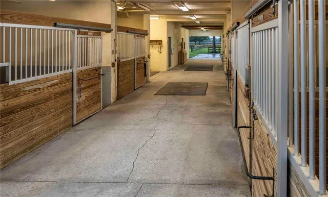 a view of a workspace with furniture and gym equipment