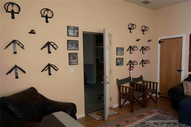 a kitchen with a table chairs refrigerator and cabinets