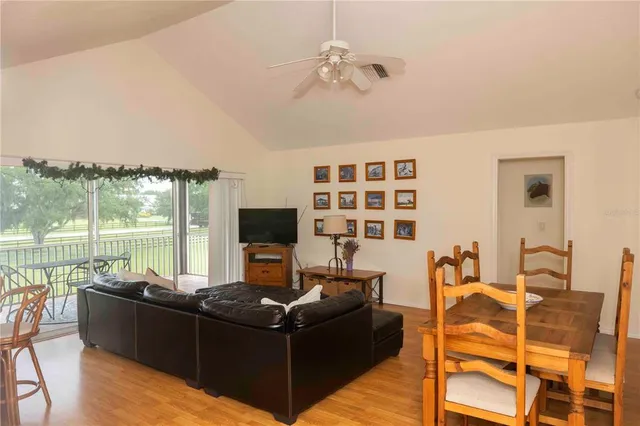 a view of a chairs and table in the balcony