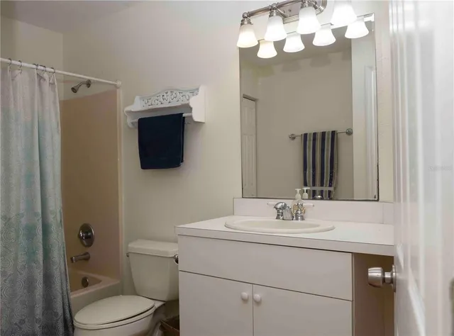 a view of house with yard and green space