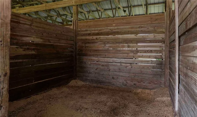 a view of a house with a yard balcony and tree