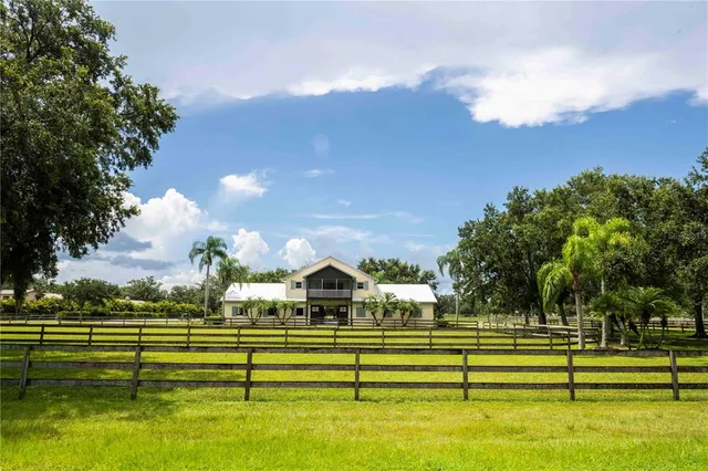 a view of swimming pool is middle and garden