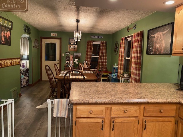 4373 East 250th Road Mendota, IL 61342 - Photo 4 of 26 a view of a kitchen with kitchen island stainless steel appliances wooden floor dining table and chairs
