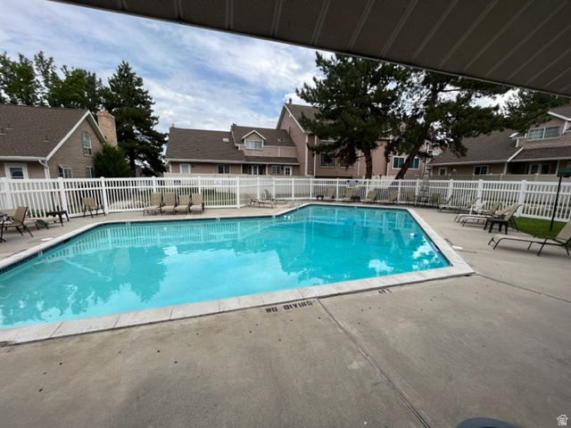 6884 670 East Midvale, UT 84047 - Photo 20 of 28 Community pool featuring a patio area