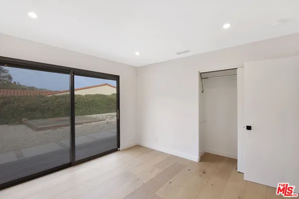 a bathroom with a mirror and a gate