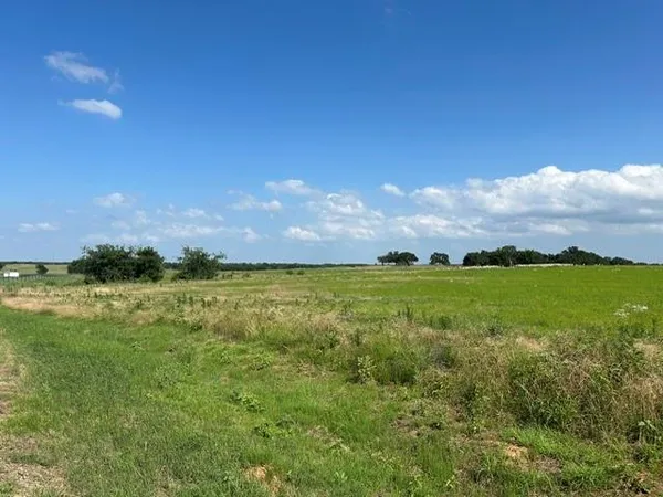 a view of an ocean and a yard