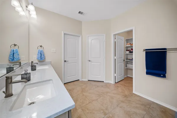 a room with view of kitchen and sink