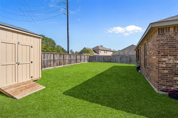 a front view of a house with backyard