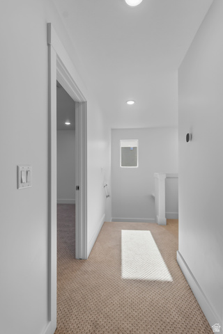 1237 West 500 South, Unit 230 Logan, UT 84321 - Photo 20 of 42 Recessed ceiling lighting, neutral carpeting, window with natural light, white wall finishes, and modern light switches
