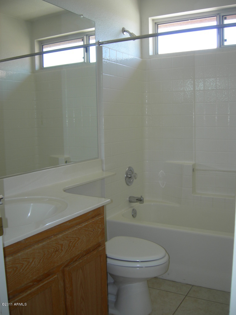 3213 East Marco Polo Road Phoenix, AZ 85050 - Photo 20 of 30 a bathroom with a sink a toilet and shower