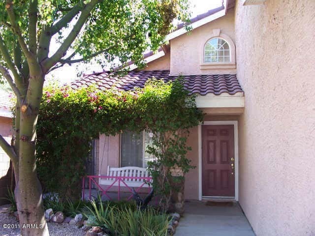 3213 East Marco Polo Road Phoenix, AZ 85050 - Photo 2 of 30 a view of a house with a tree