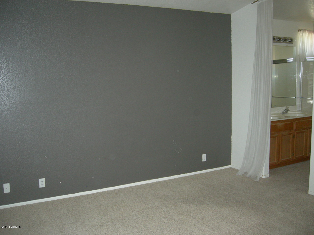 3213 East Marco Polo Road Phoenix, AZ 85050 - Photo 21 of 30 a view of an empty room with a bathroom