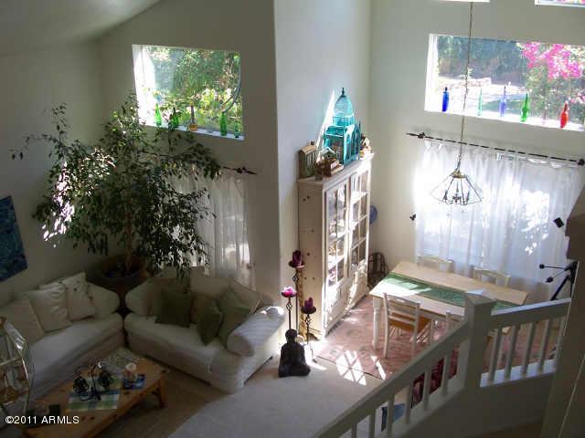 3213 East Marco Polo Road Phoenix, AZ 85050 - Photo 8 of 30 a living room with furniture and a potted plant