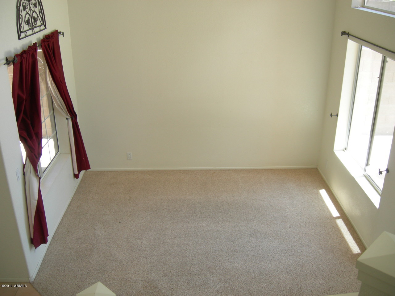 3213 East Marco Polo Road Phoenix, AZ 85050 - Photo 10 of 30 a view of an empty room and window