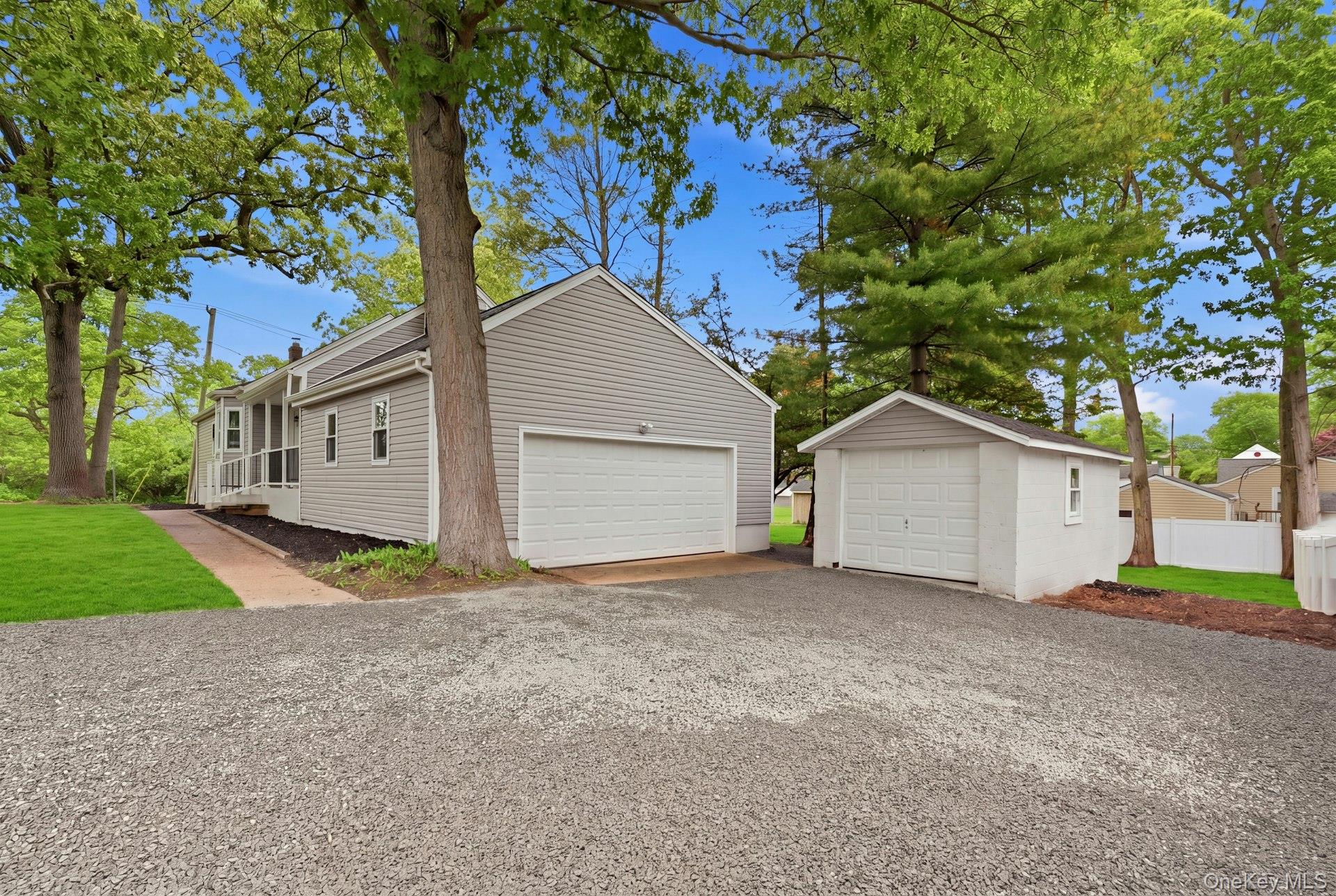 101 Rustic Road Centereach, NY 11720 - Photo 2 of 42 a view of a house with a yard and large tree
