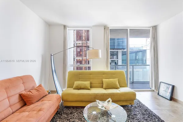 a living room with furniture and a window