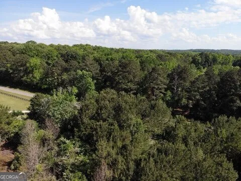 a view of a street with a yard