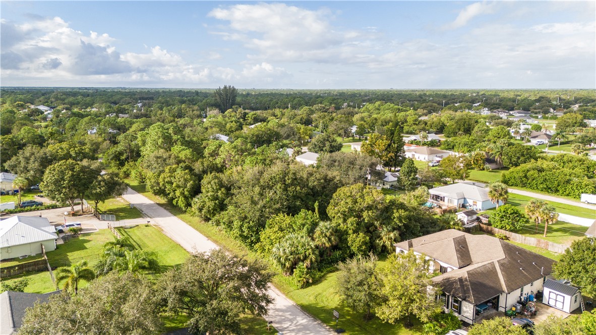 8435 96th Avenue Vero Beach, FL 32967 - Photo 13 of 20 an aerial view of residential houses with outdoor space