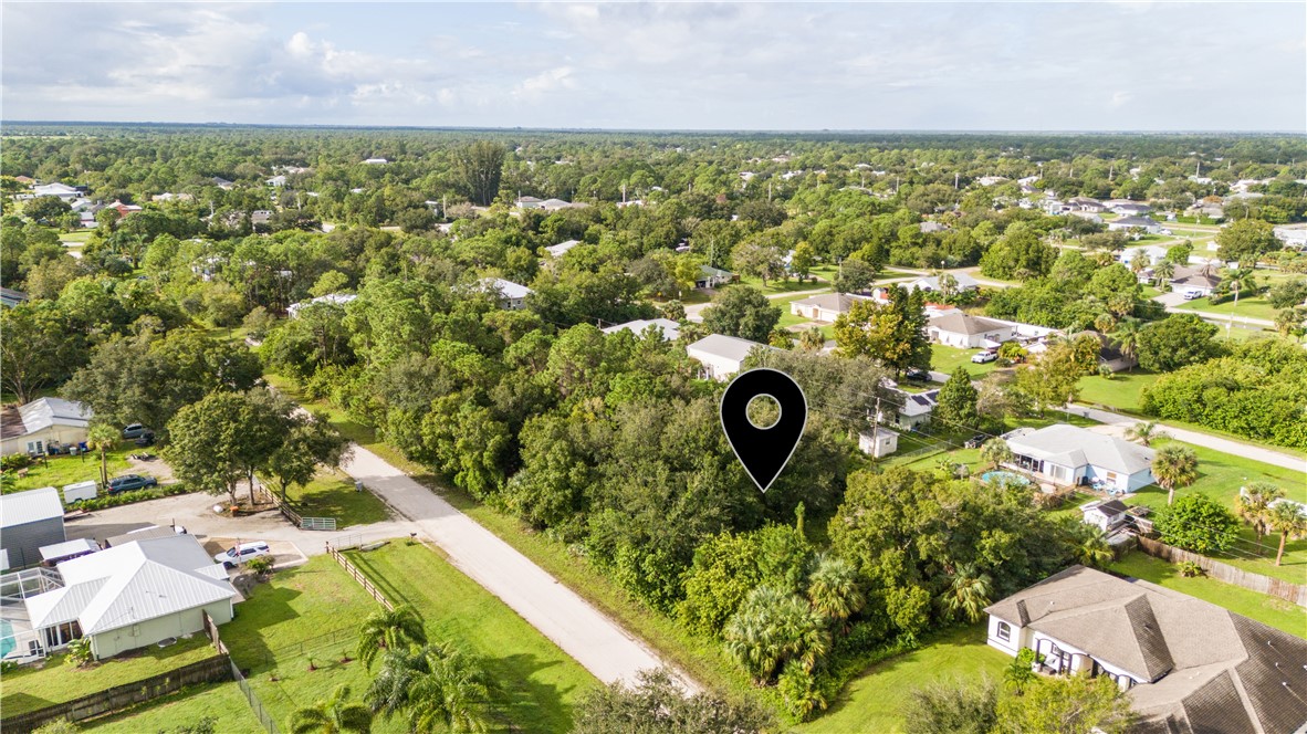 8435 96th Avenue Vero Beach, FL 32967 - Photo 3 of 20 an aerial view of a residential houses with outdoor space and street view