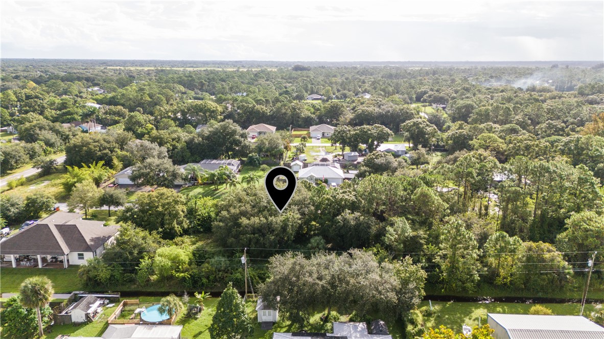 8435 96th Avenue Vero Beach, FL 32967 - Photo 8 of 20 an aerial view of a house with a yard