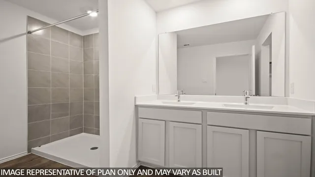 a bathroom with a shower sink and mirror