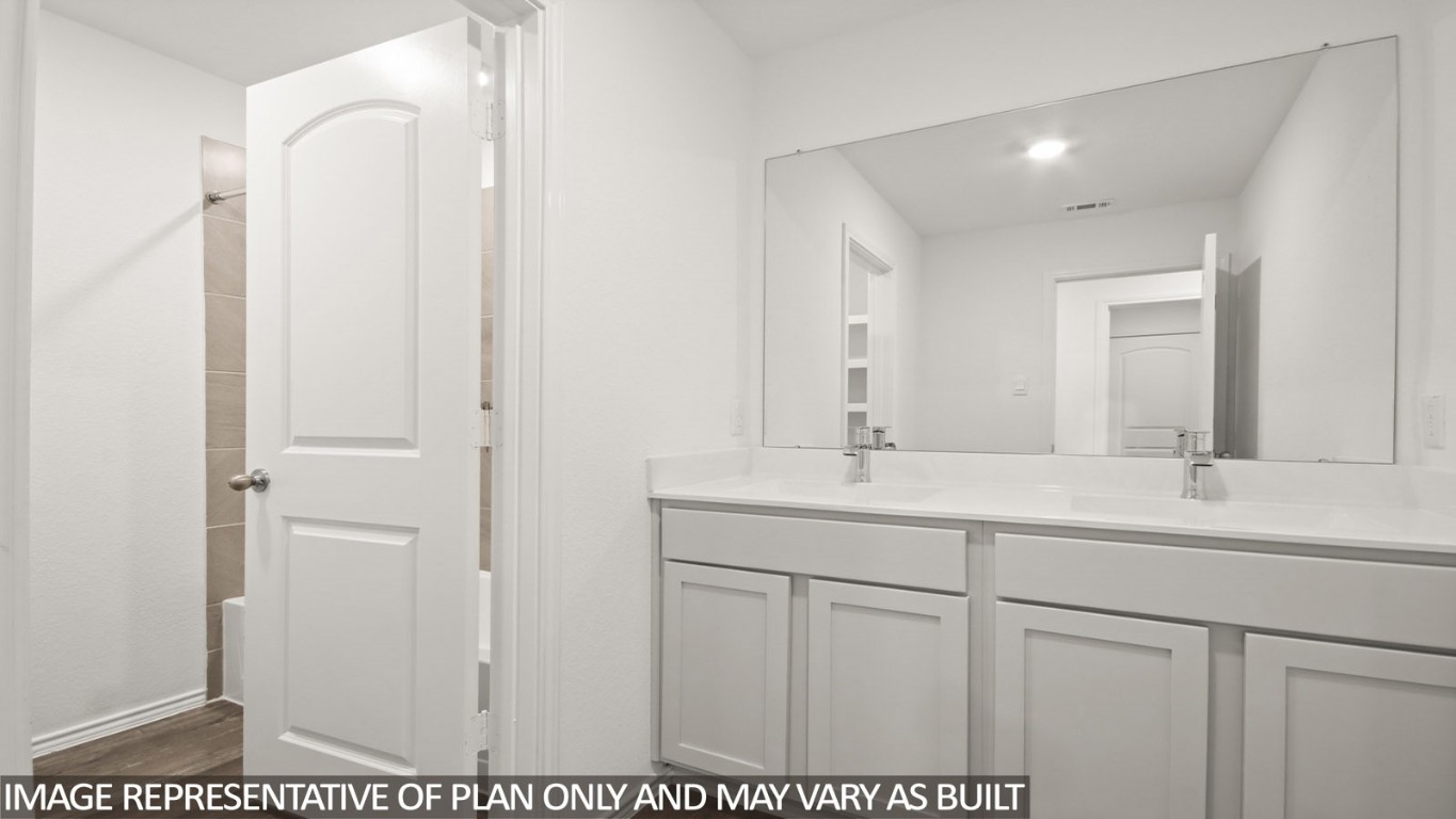1706 Portia Lane Conroe, TX 77301 - Photo 9 of 21 a bathroom with a sink and a mirror