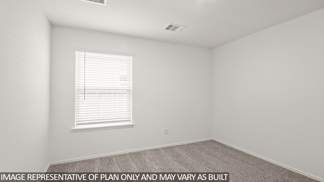 1706 Portia Lane Conroe, TX 77301 - Photo 10 of 21 a view of an empty room with a window