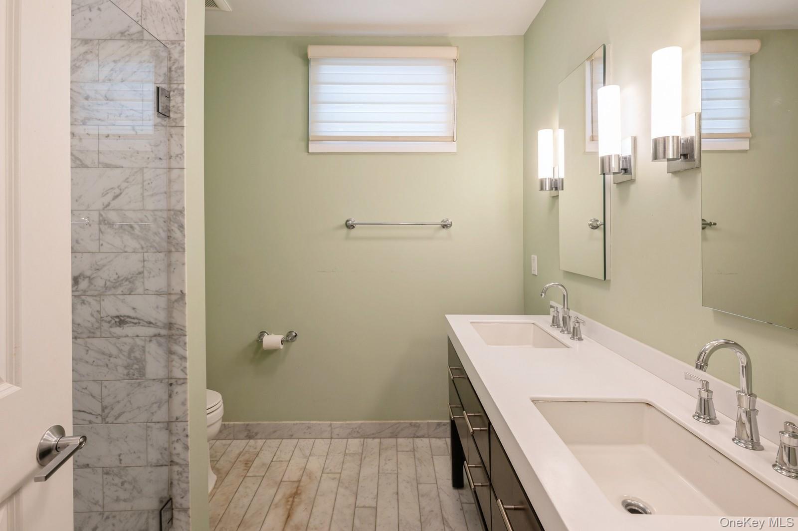 13 Island Point, Unit 13 Bronx, NY 10464 - Photo 11 of 22 Full bathroom with toilet, double vanity