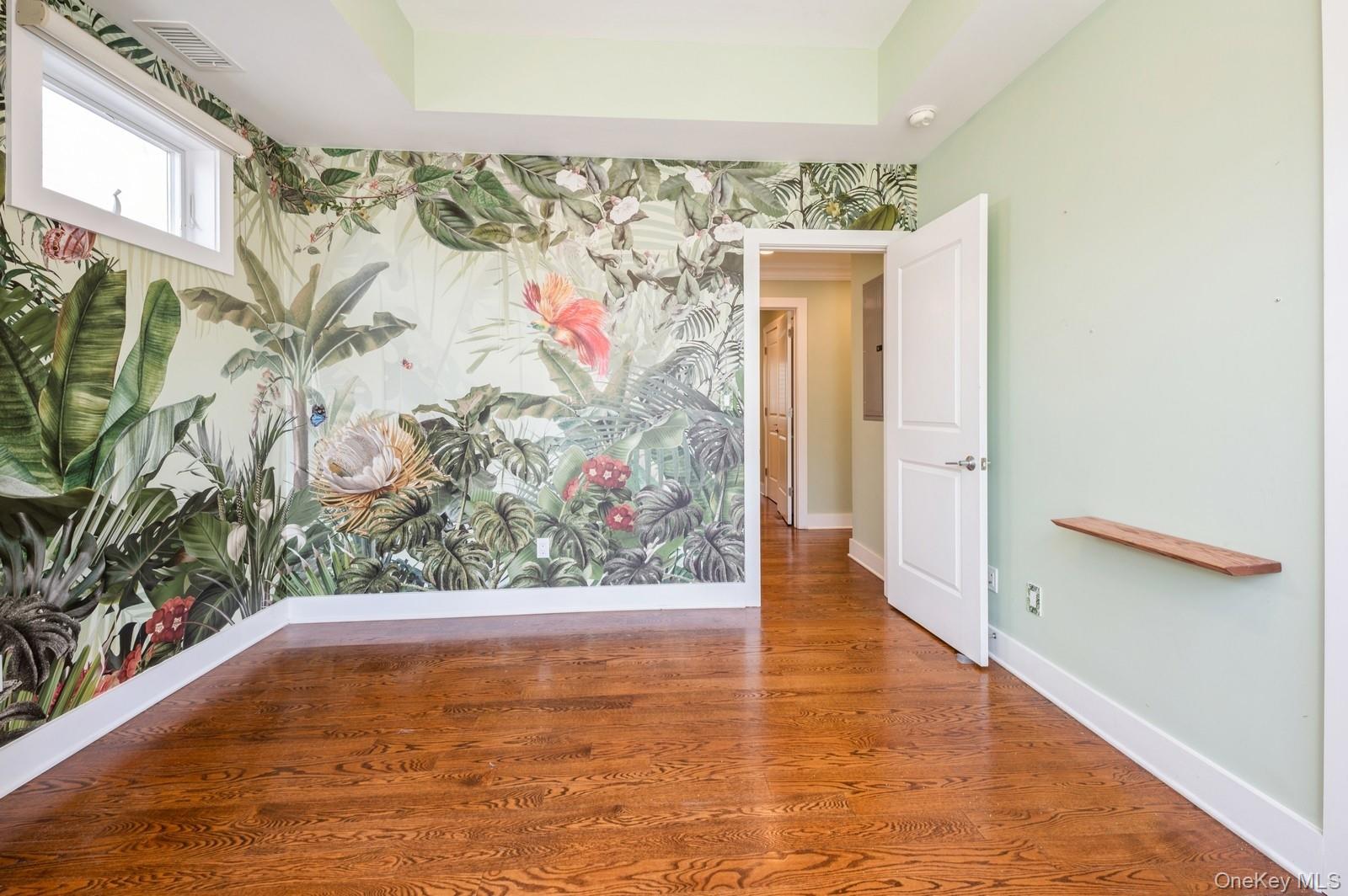 13 Island Point, Unit 13 Bronx, NY 10464 - Photo 12 of 22 Spare room with baseboards, wallpapered walls, and wood finished floors