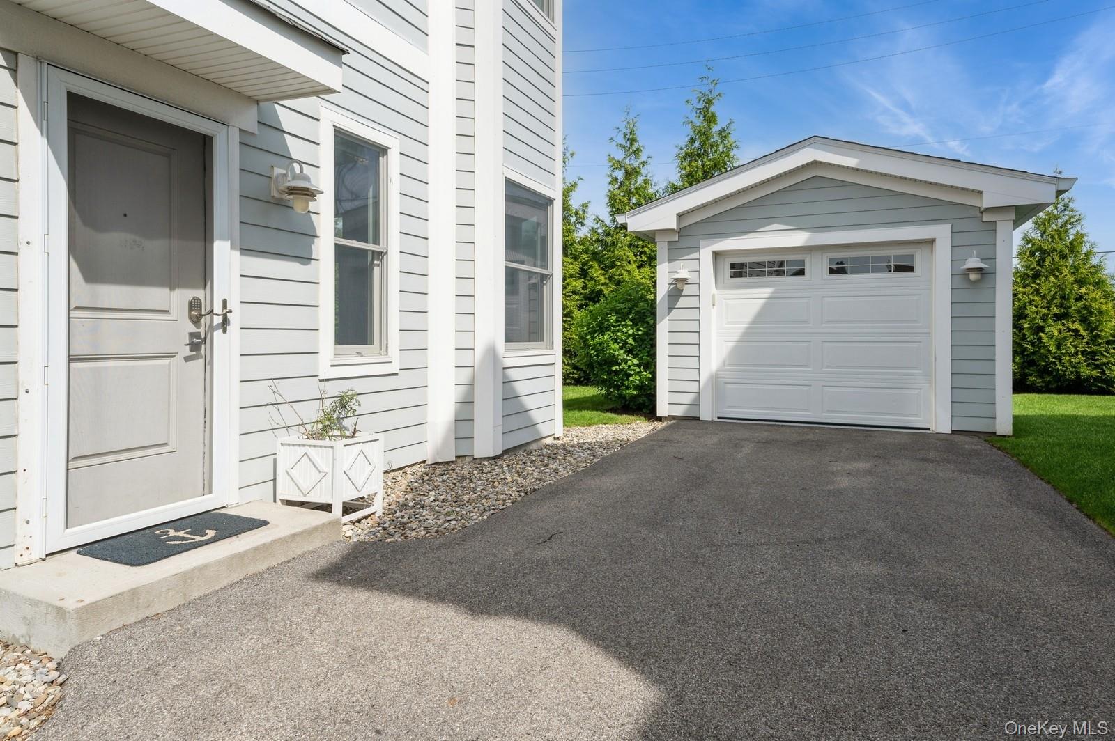 13 Island Point, Unit 13 Bronx, NY 10464 - Photo 16 of 22 Detached garage and side door entrance