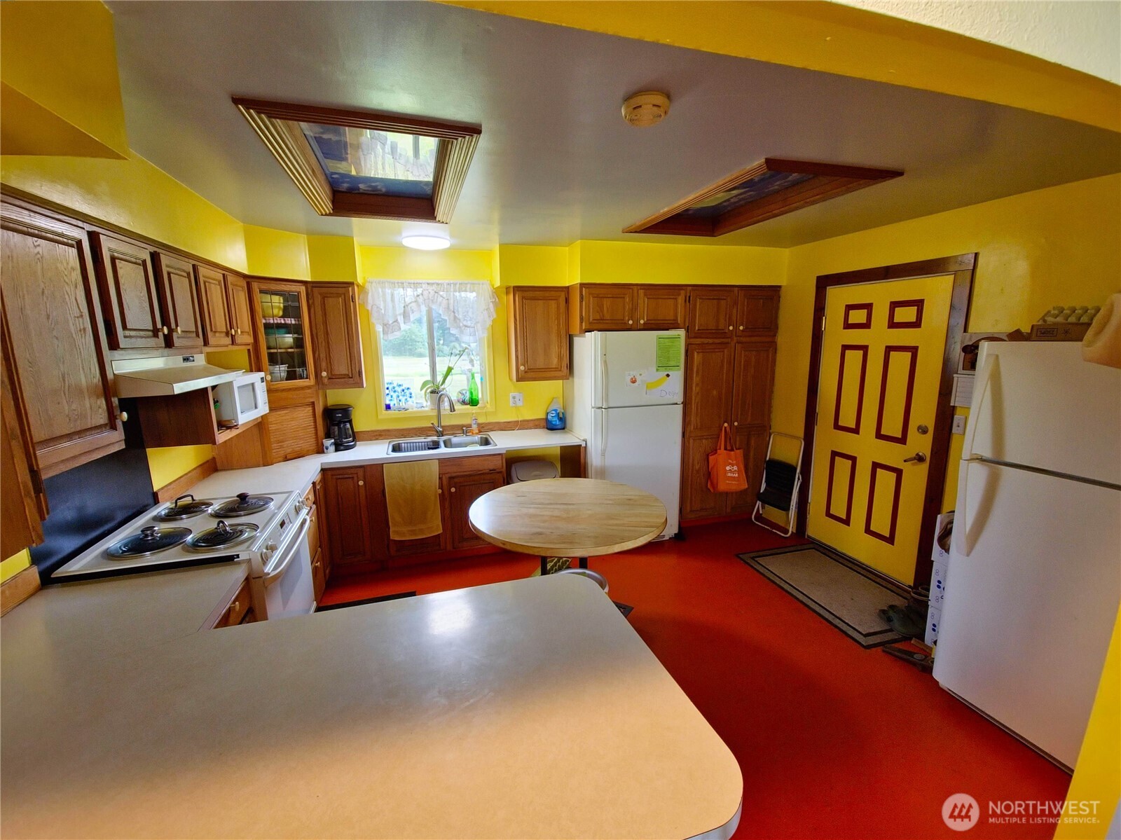 752 Parpala Road Naselle, WA 98638 - Photo 16 of 35 a view of a living room with furniture and a refrigerator