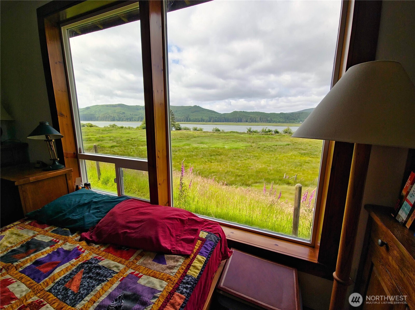 752 Parpala Road Naselle, WA 98638 - Photo 19 of 35 a bedroom with a bed and a window