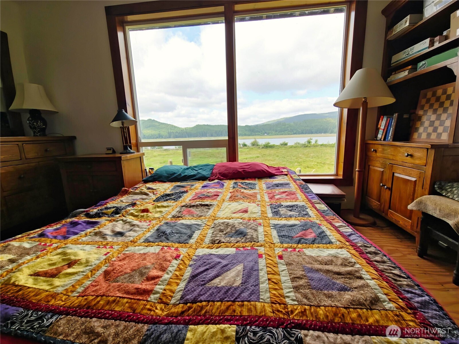 752 Parpala Road Naselle, WA 98638 - Photo 20 of 35 a bed sitting in a bedroom next to a window