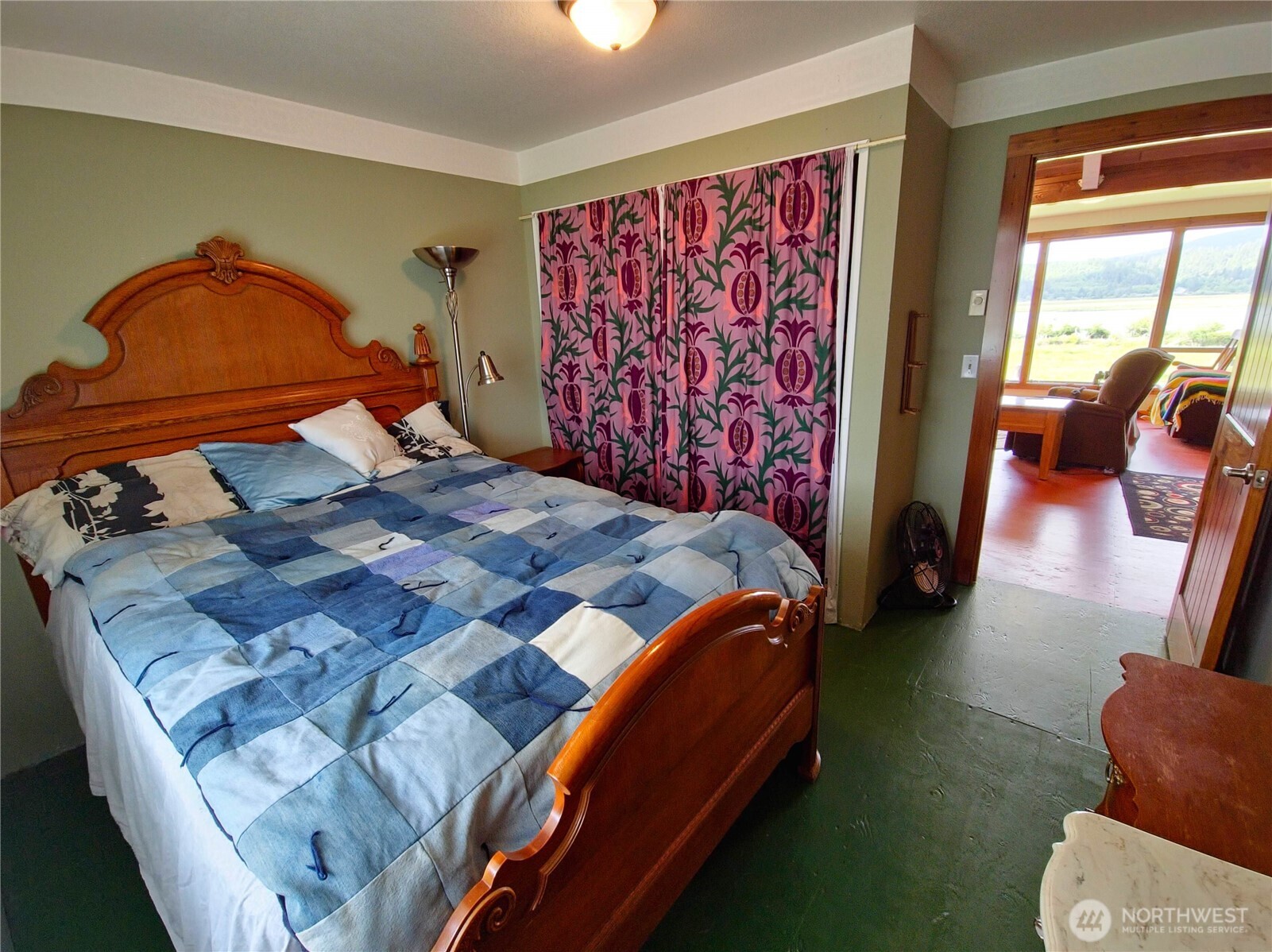 752 Parpala Road Naselle, WA 98638 - Photo 22 of 35 a bedroom with a bed and wooden floor