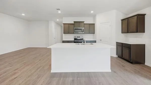 a kitchen with a sink and a window