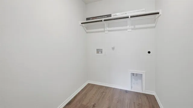 a kitchen with stainless steel appliances a sink a stove top oven a counter space and cabinets