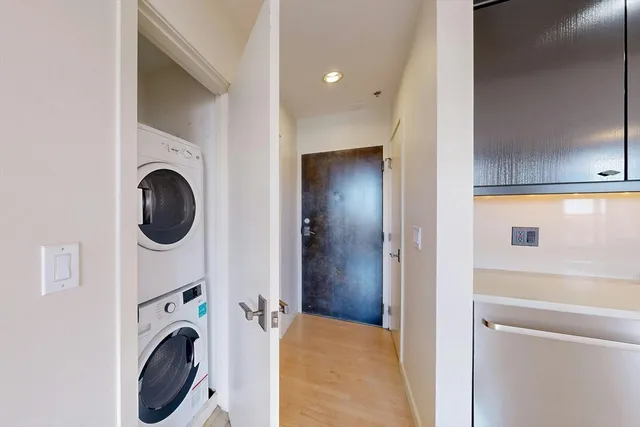 a view of a hallway with washer and dryer
