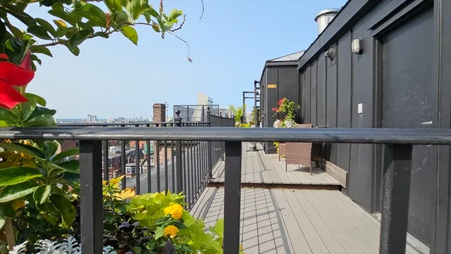 a view of a balcony with wooden floor