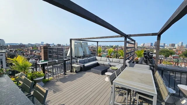 a couple of potted plants in front of door