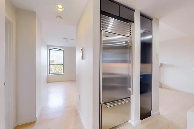 a view of a refrigerator in a kitchen